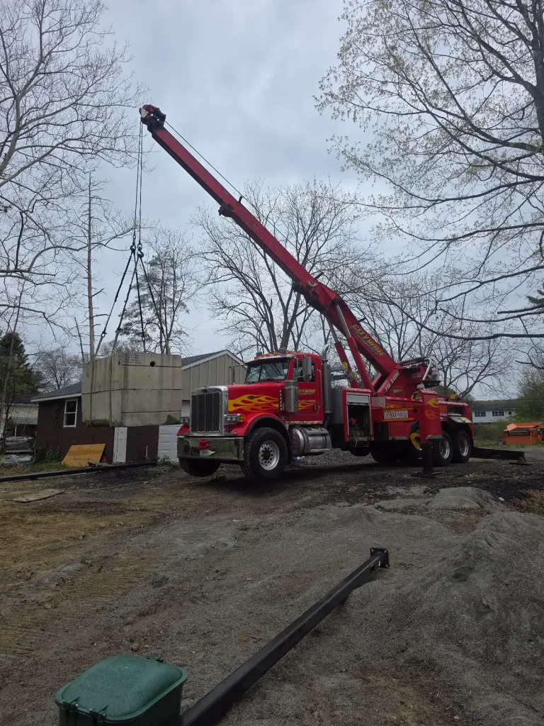 Citywide 75-ton wrecker crane-lifting a concrete vault at a job site in Putnam Valley, NY