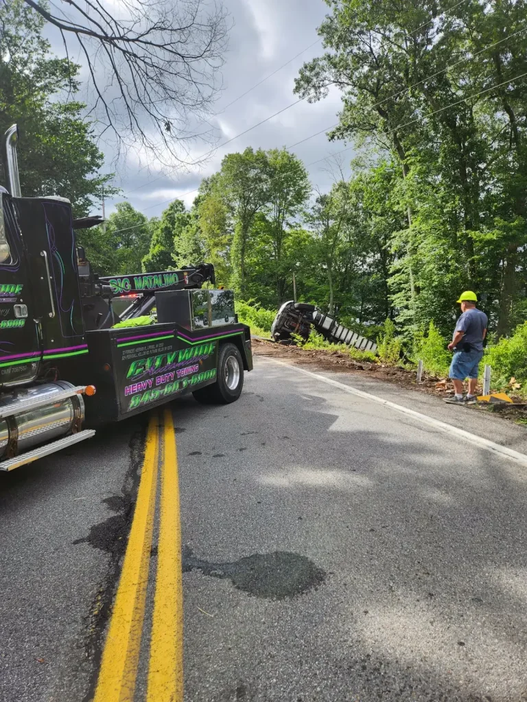 Citywide Automotive heavy-duty wrecker at an overturned dump truck recovery on a Putnam Valley, NY road