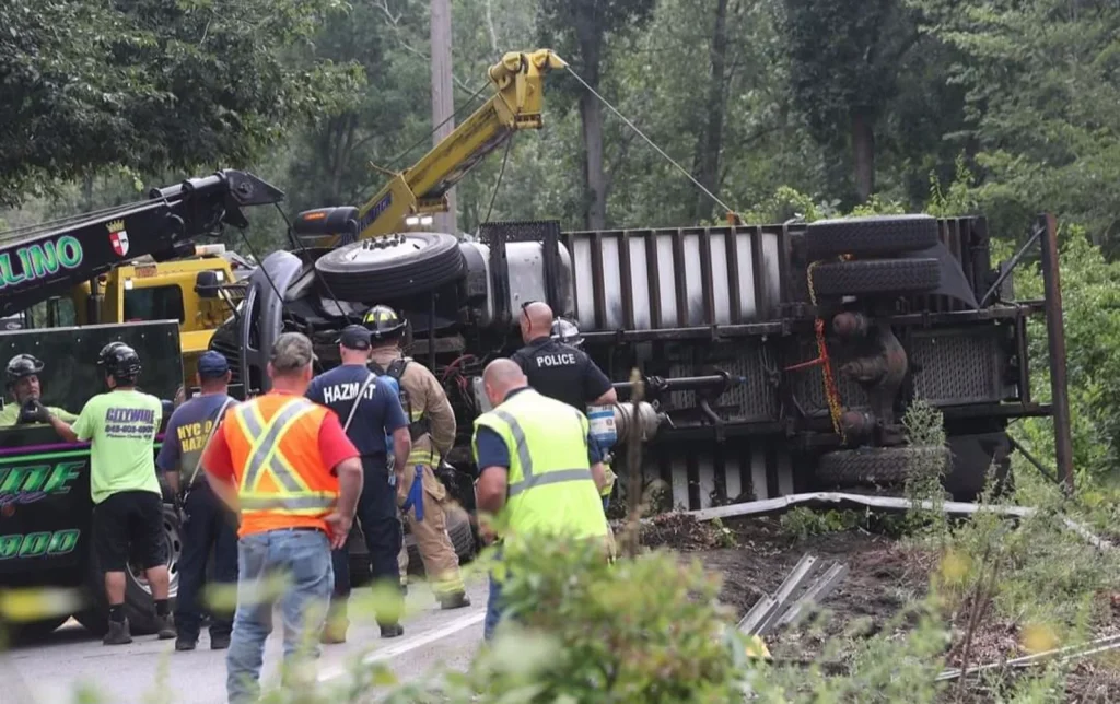 Citywide crew working alongside police, fire and hazmat at an overturned dump truck in Putnam County, NY